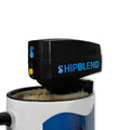 Black motorized boat motor coffee stirrer by SHIPBLEND in action, frothing milk in a white mug, highlighting its stirring capability.