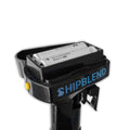 Open compartment of a black motorized boat motor coffee stirrer showing AA batteries with 'SHIPBLEND' branding on the side.